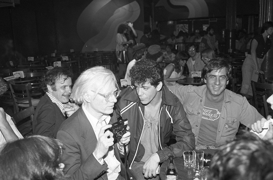 Danny Fields, right, with Andy Warhol, left, and Lou Reed, center, at a David Johansen show at the Bottom Line in New York City, July 20,1978. (Ebet Roberts/Redferns/Getty Images)