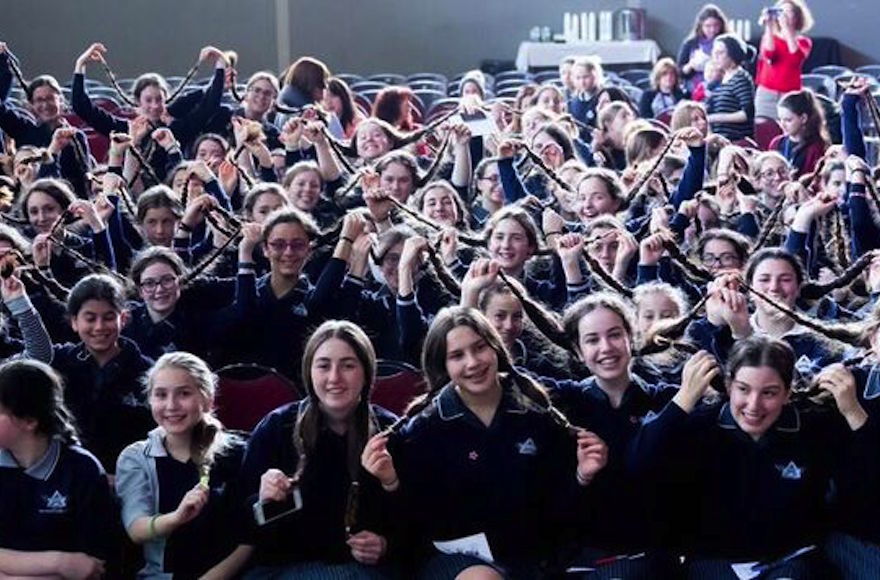 Students at Beth Rivkah Ladies College in Melbourne, Australia before donating their hair to make wigs for Israeli children with cancer, Sept. 2016 (Courtesy of Chana Franck/Chabad.org)