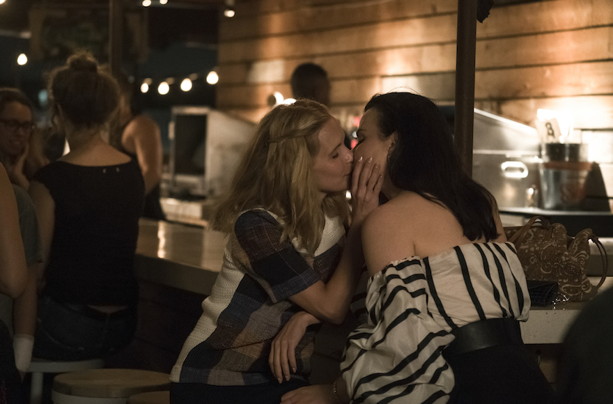 On "Younger," Malkie (Sally Pressman), left, and Maggie (Debi Mazar) kiss. (Courtesy of TV Land)